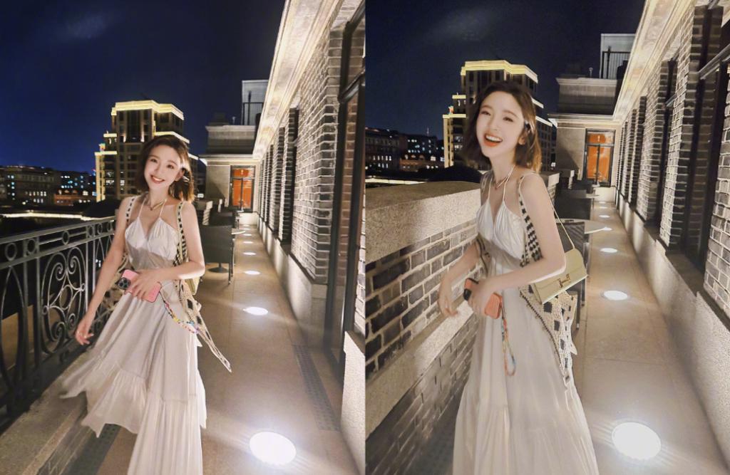 唐艺昕晒夜景美照 穿吊带裙开心比耶