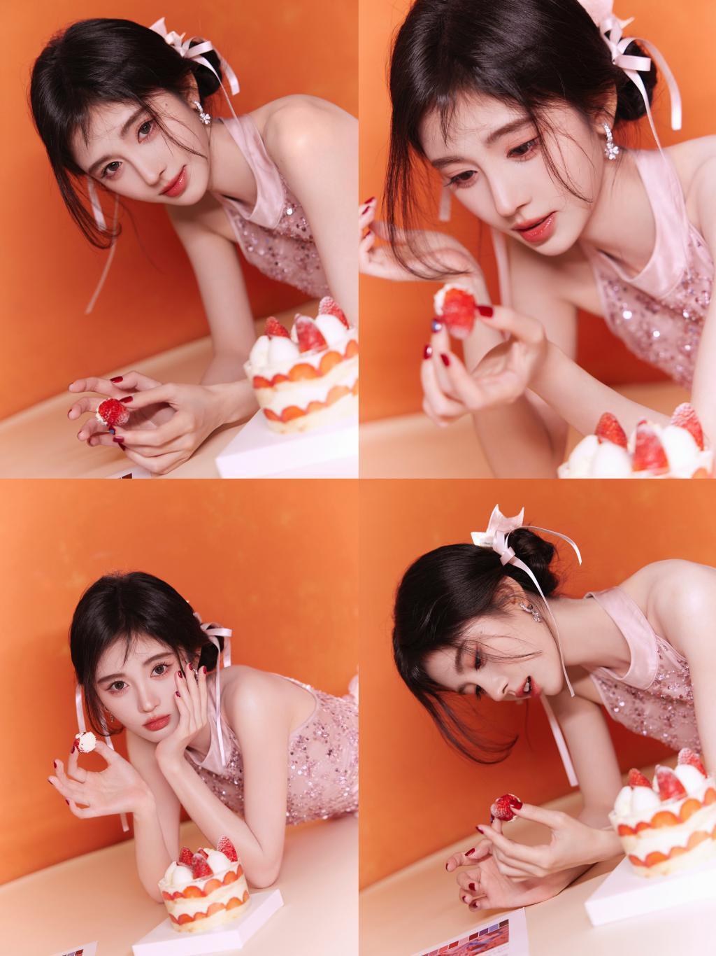 鞠婧祎穿粉裙娇俏可人 手拿甜甜圈卖萌